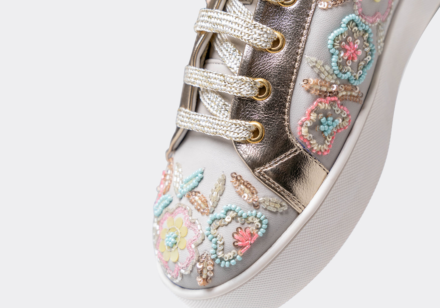 Thrive – White leather sneaker with vibrant multi-color embroidery